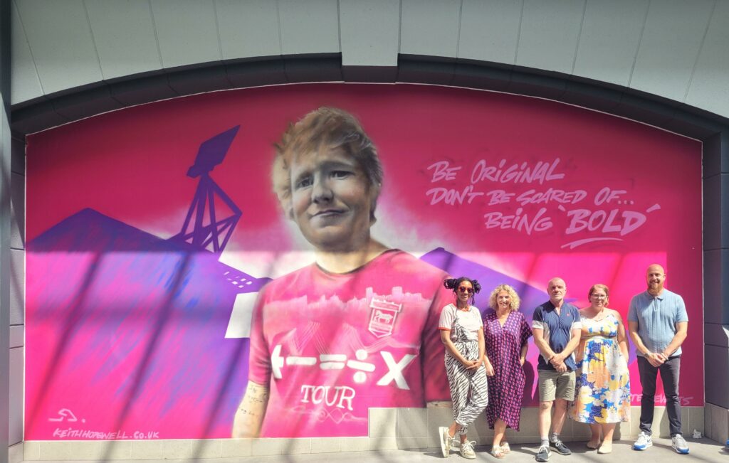 a photo of the ed sheeran mural at the buttermarket